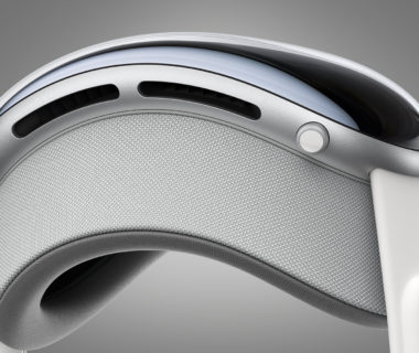 The Apple Vision Pro headset on a grey background