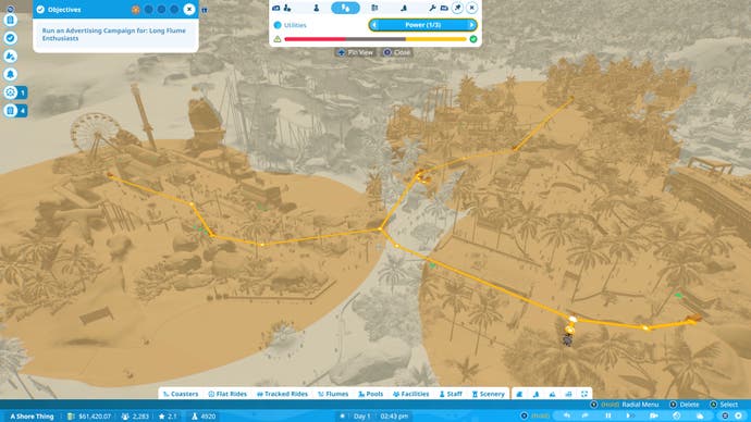 Capture d'écran de Planet Coaster 2 montrant une carte thermique de distribution d'énergie en mode Carrière.